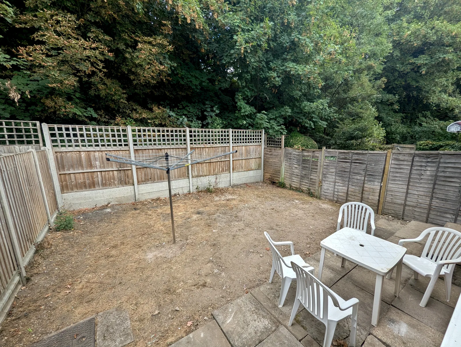 Mature trees beyond the rear garden