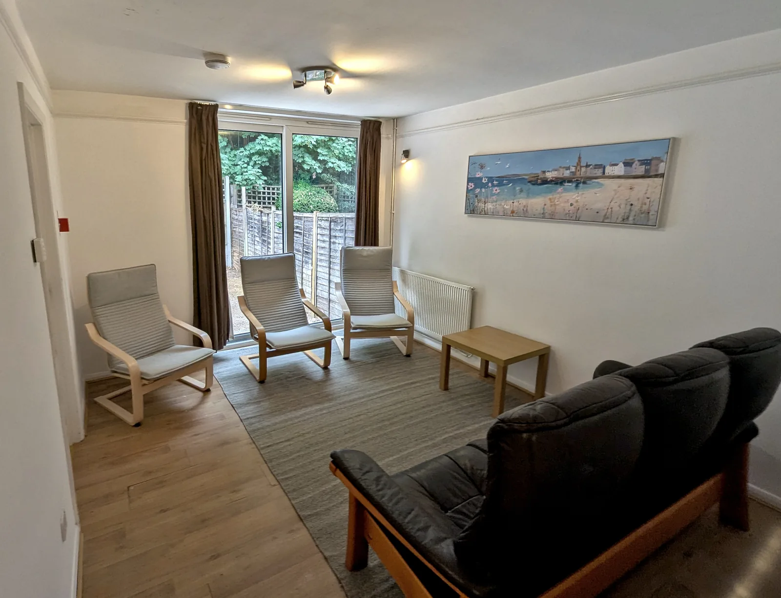 Separate furnished lounge overlooking the rear garden